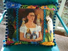 a pillow with an image of a woman and birds on it