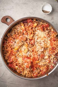 a large pot filled with lots of food on top of a table