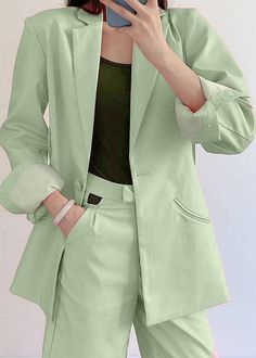 This oversized single breasted blazer is the perfect blend of feminine glamour and Androgynous power dressing. The bold padded shoulders hold the boxey shape with a twist of open back aesthetic, hung on an overtly decadent, knotted rope embellished trim. The blazer is constructed of a loosely woven suiting fabric for a slightly softly tailored fluidity and can be worn as a blazer or dress.Size Chart : Green Notch Lapel Blazer With Pockets, Spring Office Wear Solid Color Blazer, Chic Green Blazer With Pockets, Spring Green Outerwear With Lapel Collar, Trendy Green Single-breasted Blazer, Chic Green Blazer For Spring, Green Lapel Collar Outerwear For Spring, Trendy Green Formal Outerwear, Chic Long Sleeve Green Blazer