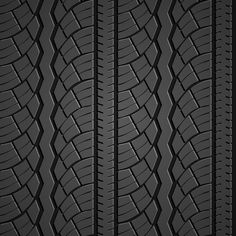 an image of tire treads textured in black and grey colors on a dark background