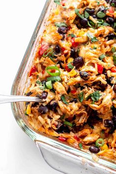 a casserole dish filled with mexican chicken and black beans