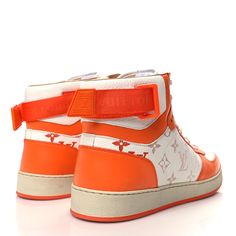 These are authentic LOUIS VUITTON Calfskin Monogram Rivoli High Top Sneakers Size 9 in Orange. These luxurious high tops are crafted of orange and white monogram calfskin leather. The shoe also features straps at the ankles. Authentic Louis Vuitton, High Top, Top Sneakers, Calf Skin, High Top Sneakers, High Tops, Louis Vuitton, Monogram, Orange