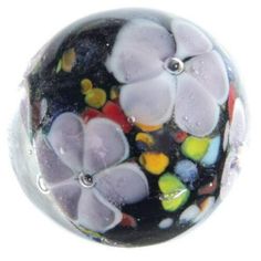 a glass bead with flowers on it