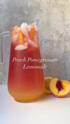 peach pomegranate lemonade in a pitcher with ice