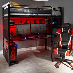 a computer desk with a chair underneath it and a red light on the bottom shelf