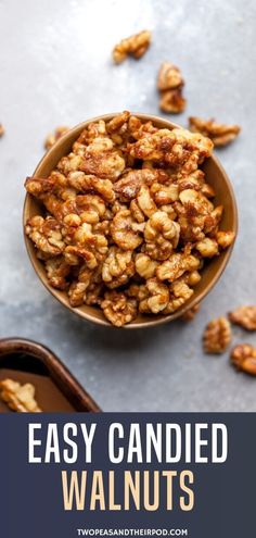 a bowl full of walnuts with the words easy candied walnuts above it