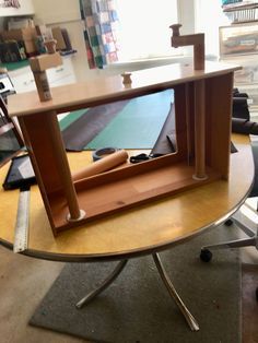 a desk with an open book shelf on it