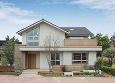 a two story house with a large front yard