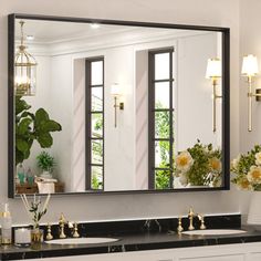 a bathroom with two sinks and a large mirror on the wall over it's sink