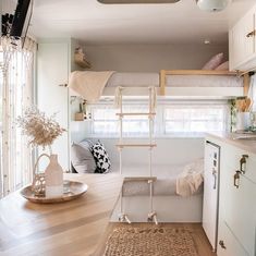 the interior of a tiny home with wood flooring