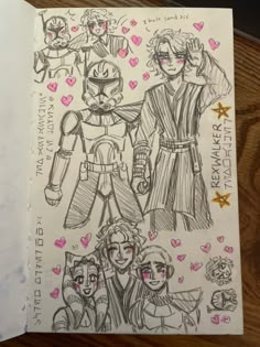 a drawing of star wars characters with hearts and stars on the paper next to them