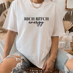 -------Rich Bitch Energy T-Shirt ------- Rich Bitch Energy T-Shirt is a motivational graphic that brings out your inner savage. This super soft and comfy sweatshirts are perfect for a workout or everyday wear with jeans for a casual look. We custom design, print, hand press, and carefully ship everything you see in our shop from our retail shop in GA. All of our items are printed on quality apparel. ------- COLORS------- White t-shirt with black vinyl All tees are unisex 100% Cotton -------CARE Easy Clothing, Clothing Templates, Cross Shirts, Boho Shirt, Moon Shirt, Religious Shirt, Faith Shirt, Boho Shirts, Comfy Sweatshirt