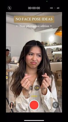 a woman is looking at the camera with her finger on her face and an orange circle in front of her