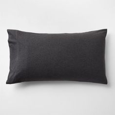 a black pillow on a white background