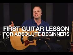 a man sitting in front of a guitar with the words first guitar lesson for absolute beginners