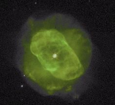 an image of a green object in the dark night sky with stars around it,