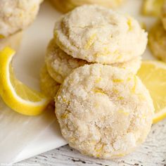 some lemon cookies are stacked on top of each other