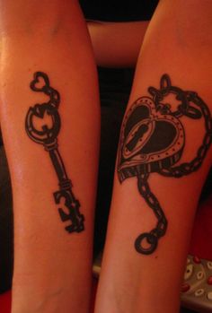 two people with matching tattoos on their arms holding keys and heart shaped key tattoo designs