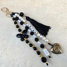 a black and white beaded necklace with charms