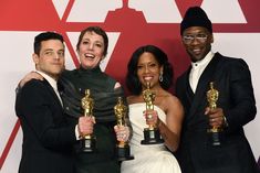 three men and two women posing with their oscars for the film's best actress