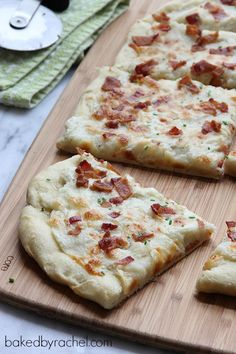 several slices of pizza on a cutting board