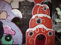 two large red and purple paper machs with holes in the middle one has an eyeball on it