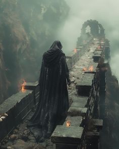 a man dressed as darth vader standing on a bridge in the middle of nowhere