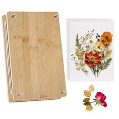 a cutting board with flowers on it next to an image of a flower and leaves