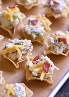 small appetizers with cheese and bacon on them are ready to be served in the oven