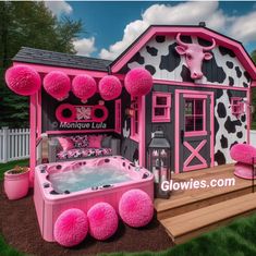 a pink and black cow themed house with hot tub