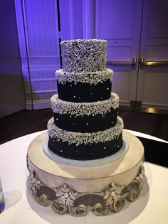 a three tiered cake sitting on top of a table