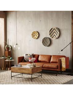 a living room filled with lots of furniture next to a wall mounted clock on the wall