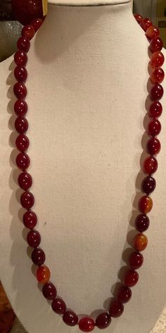 Up for Sale is this Beautiful DECO Cherry Amber Bakelite Necklace. This is a Beauty. It is in near Mint Condition. It measures 18" long. And weighs at 136 Grams. The entire necklace is Hand-Knotted. Plus there is no Clasp, as the necklace fits over the Head. Please See Photos. Formal Oval Necklace With Polished Beads, Formal Single Strand Amber Necklace, Formal Amber Single Strand Necklace, Amber Single Strand Necklace For Formal Occasions, Formal Single Strand Necklace With Oval Beads, Bakelite Necklace, Norfolk Va, Amber Necklace, Amber Beads