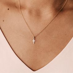 Part of our Madi Nelson x Tiny Tags Collection, our unique and delicate take on this meaningful symbol is perfect to wear alone or layered with your favorite necklace. vermeil: sterling silver base with 100+ mls of 24k gold hangs on a 14k gold filled chain cross is 9mm tall and 5.5mm wide also available in sterling silver + 14k yellow gold + pavé diamond Womens Gold Necklaces, 14k Gold Cross Pendant Jewelry For Everyday, Minimalist 14k Gold Cross Pendant Necklace, Minimalist 14k Gold Cross Necklace With Delicate Chain, Everyday 14k Yellow Gold Cross Necklace, Yellow Gold Charm Necklace With Cross Pendant, Yellow Gold Cross Pendant Charm Necklace With Delicate Chain, Minimalist Gold Plated Cross Necklace, Dainty Yellow Gold Cross Necklace With Adjustable Chain