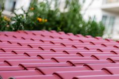 the roof of a building with red tiles on it