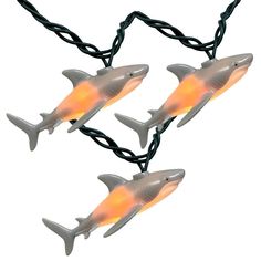 three lights that have sharks on them in the shape of two dolphins with orange eyes