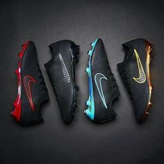 four different nike shoes lined up in a row on a black surface with one red, one blue and one yellow