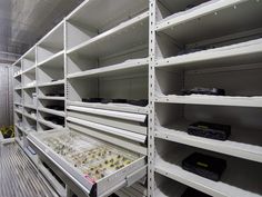 rows of shelves with electronic equipment on them