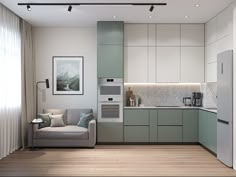 a living room and kitchen area with light colored cabinets, white walls and wood flooring