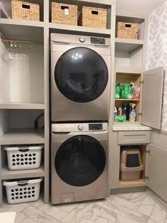 a washer and dryer in a laundry room with baskets on the shelves next to them