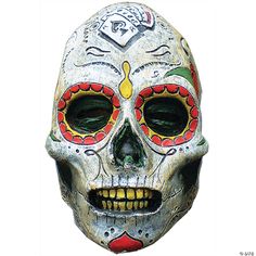 a white skull mask with red, green and yellow designs