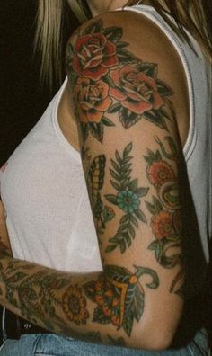 a woman with many tattoos on her arm