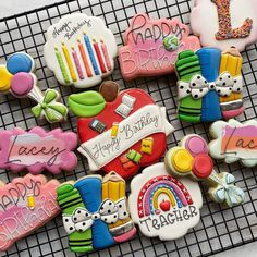 decorated cookies on a cooling rack with happy birthday messages