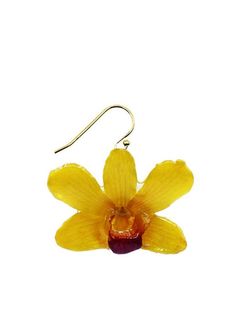 a pair of earrings with yellow flowers hanging from them