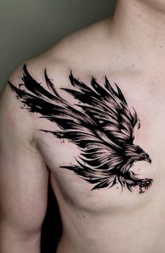 a man's chest with an eagle tattoo on it