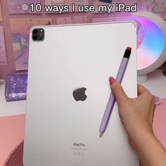 a person holding an ipad with a pen in their hand and the caption reads, 10 ways i use my ipad