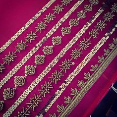 a purple cloth with gold trims on it