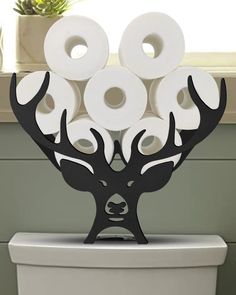 PRICES MAY VARY. ANTLERS ACCENT FOR BATHROOM DECOR: Adorable antlers decor toilet paper holder stand make storing reserve toilet rolls paper cute and fun. In your farmhouse bathroom, bedroom or living room, it is easy to stand firmly on the ground or on top of the toilet tank. Adding a whimsical touch of rustic charm to your sweet home. EXTRA 8 ROLLS STORAGE: Do you feel embarrassed when you go to the toilet without paper? We solve your problems with this paper towel holder. Our standing toilet Tissue Paper Storage, Loo Roll Holders, Toilet Paper Holder Stand, Novelty Decor, Antlers Decor, Bathroom Accessories Luxury, Toilet Paper Roll Holder, Toilet Paper Storage, Bathroom Tissue