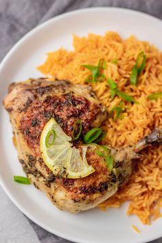 a white plate topped with chicken and rice