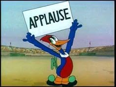 a cartoon character holding up a sign that says applause